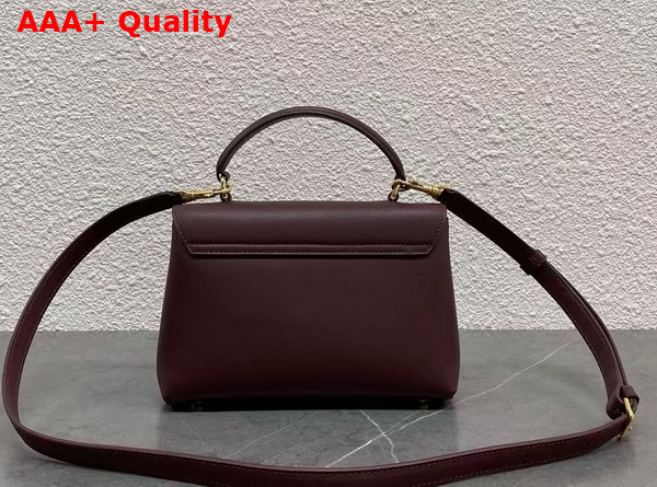 Celine Teen Nino Bag in Smooth Satinated Calfskin with Enamel Closure Syrah Replica
