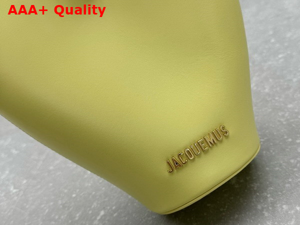 Jacquemus The Small Bambola Asymmetric Mini Bucket Bag in Light Yellow Smooth Leather Replica