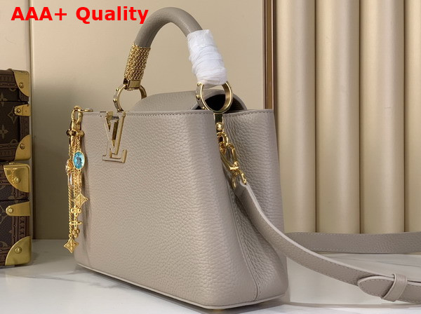 Louis Vuitton Capucines BB Handbag in Galet Gray Taurillon Leather Embellished with Tonal LV Initials and a Decorative Stone Embellished Charm Replica