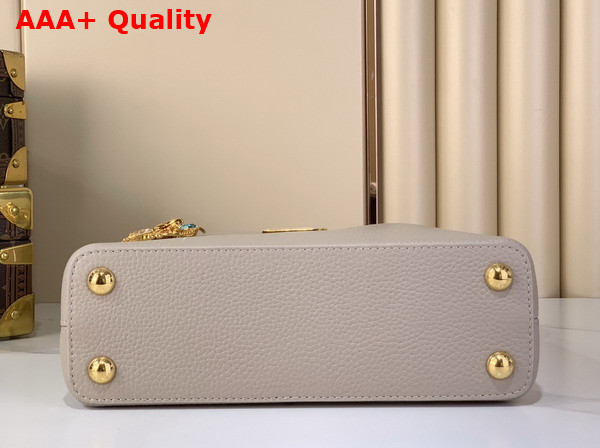 Louis Vuitton Capucines BB Handbag in Galet Gray Taurillon Leather Embellished with Tonal LV Initials and a Decorative Stone Embellished Charm Replica
