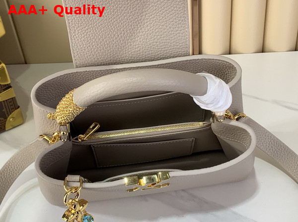 Louis Vuitton Capucines BB Handbag in Galet Gray Taurillon Leather Embellished with Tonal LV Initials and a Decorative Stone Embellished Charm Replica