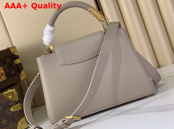 Louis Vuitton Capucines BB Handbag in Galet Gray Taurillon Leather with Gold Toned Charm Detail Replica