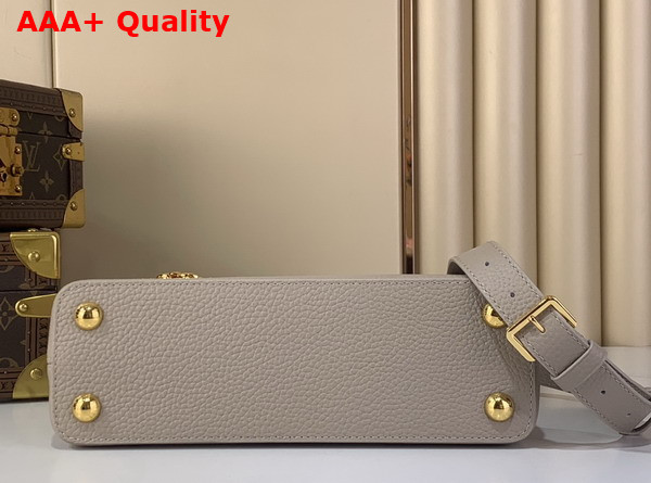 Louis Vuitton Capucines BB Handbag in Galet Gray Taurillon Leather with Gold Toned Charm Detail Replica