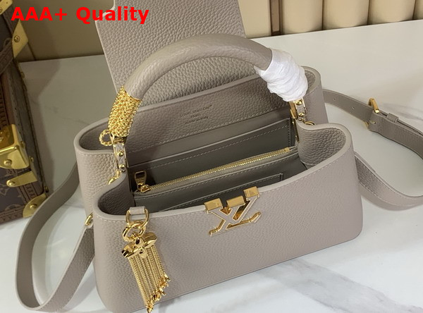 Louis Vuitton Capucines BB Handbag in Galet Gray Taurillon Leather with Gold Toned Charm Detail Replica