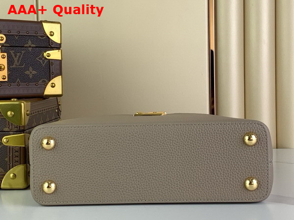 Louis Vuitton Capucines BB Handbag in Galet Gray Taurillon Leather with Golden Monogram Blossom in Metal Replica