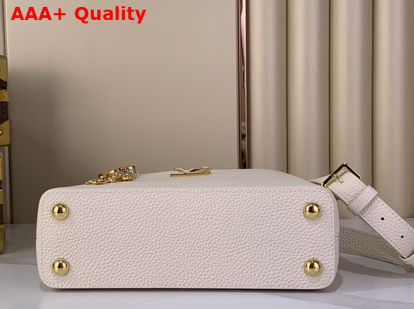 Louis Vuitton Capucines BB Handbag in Vanilla Taurillon Leather Embellished with Tonal LV Initials and a Decorative Stone Embellished Charm Replica