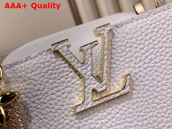Louis Vuitton Capucines BB Handbag in Vanilla Taurillon Leather Embellished with Tonal LV Initials and a Decorative Stone Embellished Charm Replica