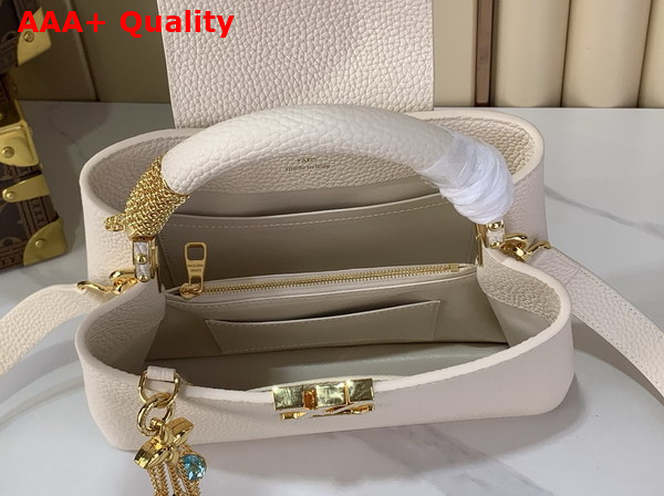 Louis Vuitton Capucines BB Handbag in Vanilla Taurillon Leather Embellished with Tonal LV Initials and a Decorative Stone Embellished Charm Replica