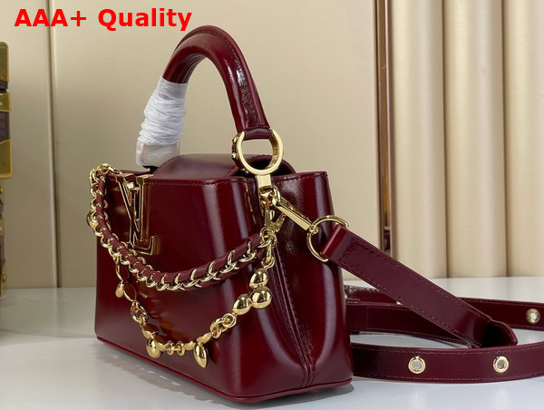 Louis Vuitton Capucines East West Mini Grenat Red Cowhide Leather Elevated with Gold Toned LV Initials M25473 Replica