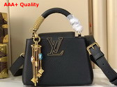 Louis Vuitton Capucines Mini Handbag in Black Taurillon Leather Embellished with Tonal LV Initials and a Decorative Stone Embellished Charm Replica