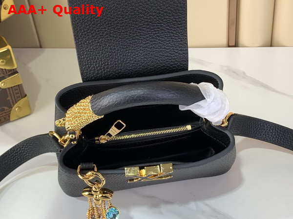Louis Vuitton Capucines Mini Handbag in Black Taurillon Leather Embellished with Tonal LV Initials and a Decorative Stone Embellished Charm Replica