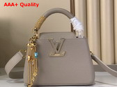 Louis Vuitton Capucines Mini Handbag in Galet Gray Taurillon Leather Embellished with Tonal LV Initials and a Decorative Stone Embellished Charm Replica