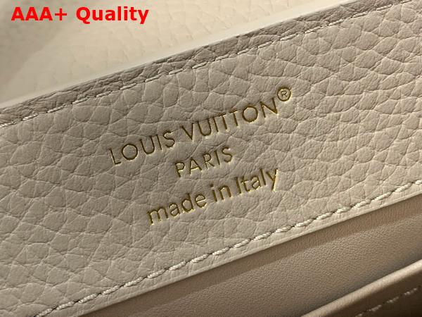 Louis Vuitton Capucines Mini Handbag in Galet Gray Taurillon Leather Embellished with Tonal LV Initials and a Decorative Stone Embellished Charm Replica
