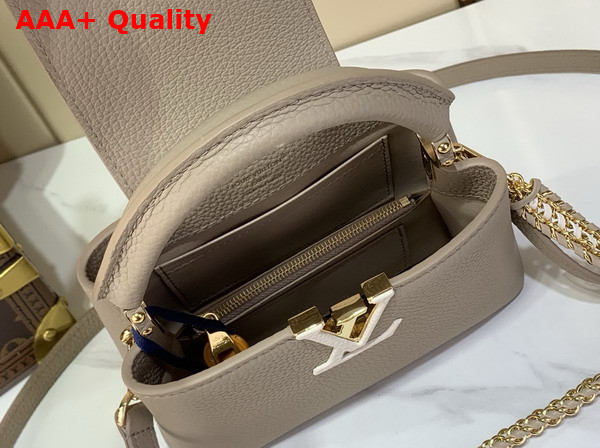 Louis Vuitton Capucines Mini Handbag in Galet Grey Taurillon Leather with Hand Braided Chain M29440 Replica