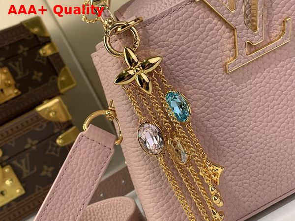 Louis Vuitton Capucines Mini Handbag in Jasmine Pink Taurillon Leather Embellished with Tonal LV Initials and a Decorative Stone Embellished Charm Replica