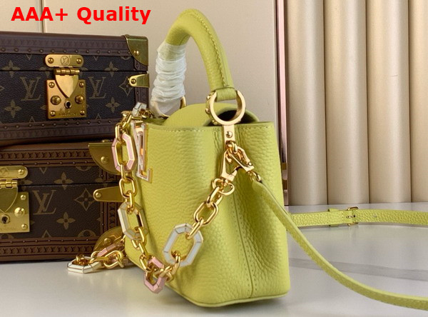 Louis Vuitton Capucines Mini Handbag in Sun Beam Yellow Taurillon Leather Features a Joyfully Arty Enameled Chain M25232 Replica