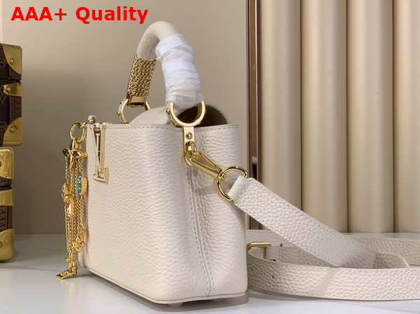 Louis Vuitton Capucines Mini Handbag in Vanille Taurillon Leather Embellished with Tonal LV Initials and a Decorative Stone Embellished Charm Replica