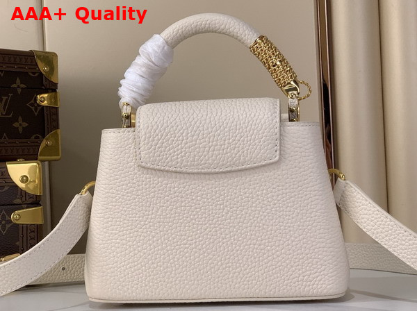 Louis Vuitton Capucines Mini Handbag in Vanille Taurillon Leather Embellished with Tonal LV Initials and a Decorative Stone Embellished Charm Replica