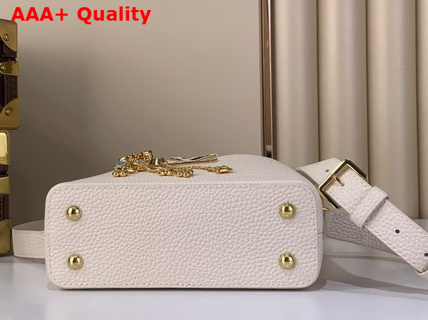 Louis Vuitton Capucines Mini Handbag in Vanille Taurillon Leather Embellished with Tonal LV Initials and a Decorative Stone Embellished Charm Replica