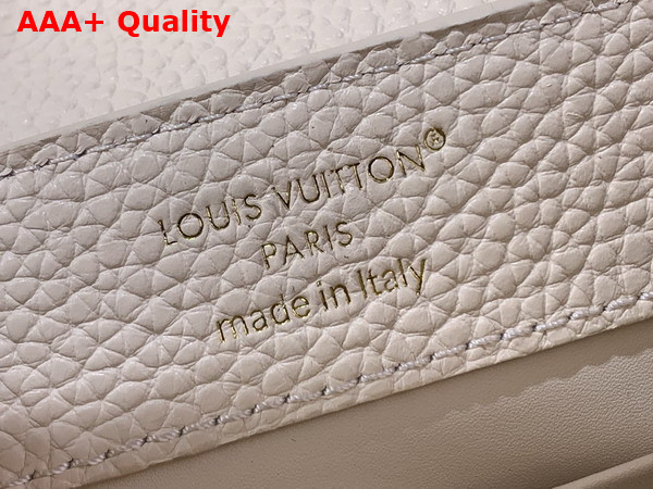 Louis Vuitton Capucines Mini Handbag in Vanille Taurillon Leather Embellished with Tonal LV Initials and a Decorative Stone Embellished Charm Replica