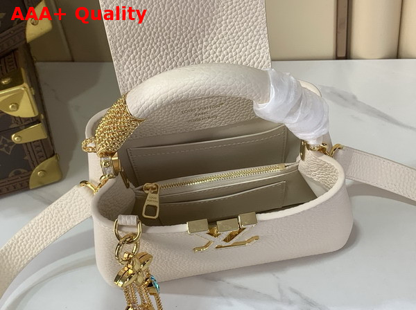 Louis Vuitton Capucines Mini Handbag in Vanille Taurillon Leather Embellished with Tonal LV Initials and a Decorative Stone Embellished Charm Replica