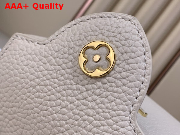 Louis Vuitton Capucines Mini Handbag in Vanille Taurillon Leather Embellished with Tonal LV Initials and a Decorative Stone Embellished Charm Replica
