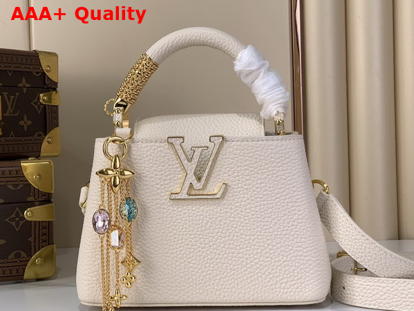 Louis Vuitton Capucines Mini Handbag in Vanille Taurillon Leather Embellished with Tonal LV Initials and a Decorative Stone Embellished Charm Replica