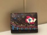 Louis Vuitton Victorine Wallet in Monogram Canvas Features a Colorful Illustration of Louis Vuittons Vivienne Mascot Riding a Roller Coaster M69751 Replica