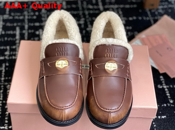 Miu Miu Bleached Leather and Shearling Penny Loafers in Ebony 5D530E Replica