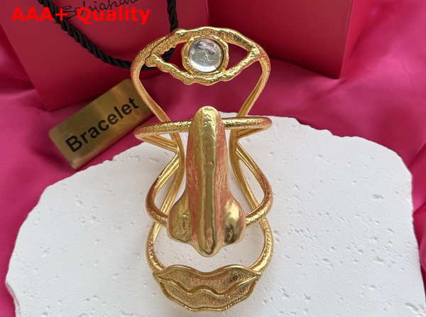 Schiaparelli Face Cuff Bracelet in Gilded Brass Replica